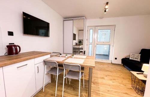 Poddabie Apartamento | RAJSKA PLAZA Poddąbie Basen odkryty brodziki Basen kryty Plac zabaw Animacje