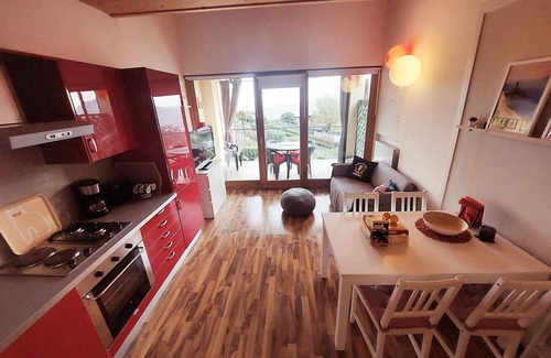 Villanuova sul Clisi Villa | Red villa with shared pool and private garden is the new black on Lake Garda