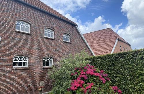 Strackholt Apartamento | Reihenhaus in Strackholt mit beheiztem Pool