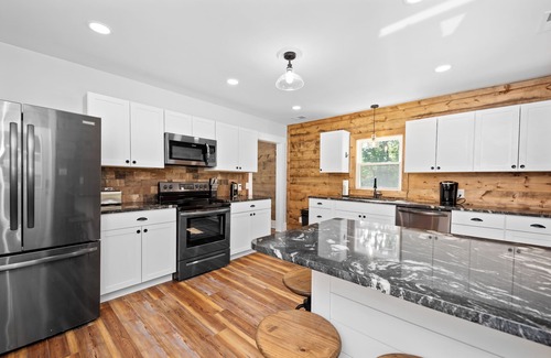 Bentonville Casa | Relax and Unwind at River Front Oasis w/ Hot Tub