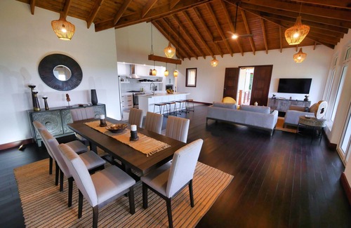 Gibson Bight Casa | Relax at this hillside retreat that overlooks the lush forest and the Caribbean.