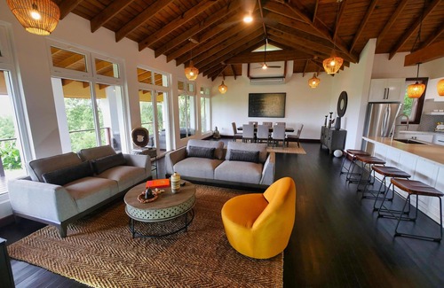 Gibson Bight Casa | Relax at this hillside retreat that overlooks the lush forest and the Caribbean.