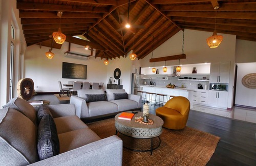 Gibson Bight Casa | Relax at this hillside retreat that overlooks the lush forest and the Caribbean.