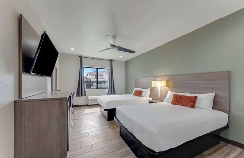 Eastside Promise Neighborhood Hotel | Relax in a Pet-Friendly Room w/ Convenient Amenities – Prime Location in DT