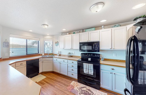 Belfair Casa | Relaxing bay front house with mountain views, lovely deck, wood-stove & firepit