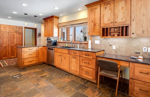 Broadmoor Casa | Relaxing Home with Private Hot Tub, Fast WiFi, Gas Fireplace, and Washer/Dryer