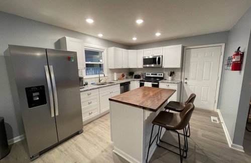 Manchester Casa | Remodeled Cottage with Sunroom