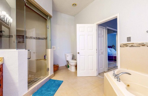 Loxahatchee Casa | Renovated, elegant retreat with a fitness room, work desks, large deck, & W/D