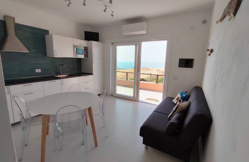 Torre dei Corsari Apartamento | Renovated house overlooking dunes and pristine sea.