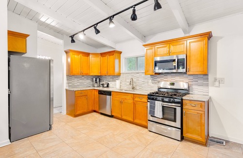 Buford Highway Casa | Renovated retreat with large deck, fireplace, & washer/dryer - dog-friendly