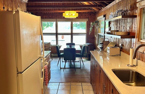 Traverse City Cabaña | Renovated Traverse City Lake House with Private Frontage & Sunset Views, Kayaks