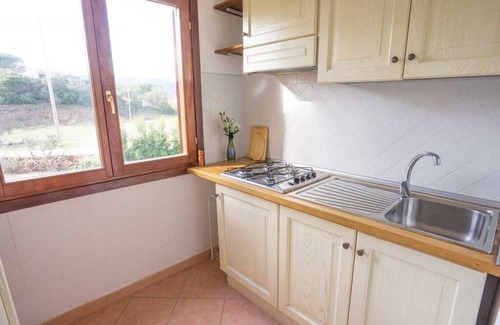 Baia Sant'Anna Apartamento | Residence Baia Sant'Anna with swimming pool and two bathrooms BudoniRentals