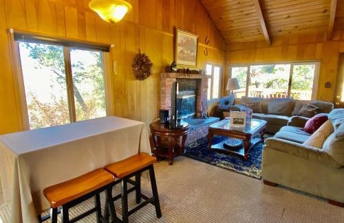 Upper Moonridge Casa | Rest N Relax Inn - Beautiful chalet-style cabin features dramatic forest and slope views!