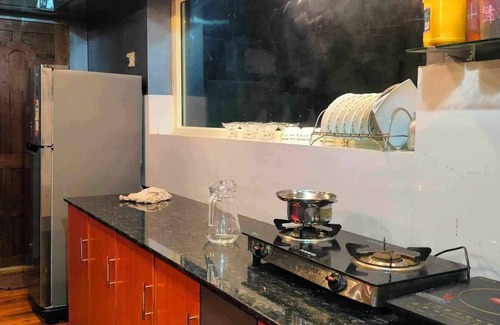 Thalassery Cabaña | River view Family Room, A1 Suite-Bar chair, Ac, Kitchen, Wi-Fi