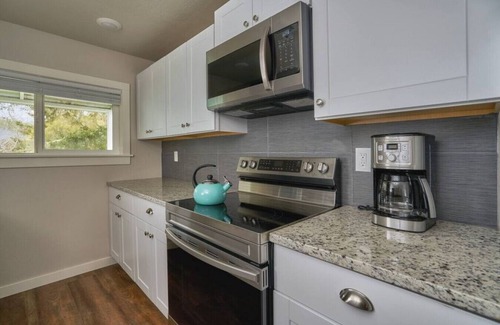 Brookings Cabaña | Riverfront Cottage with Hot Tub 1/4 mi from Beach