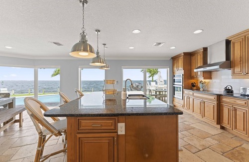 Cocoa Isles Country Club Casa | Dolphin Paradise-5 BDRM-Riverfront-Pool-Game Room