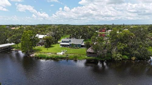 Braden River Casa | Riverside Oasis Home w Tiki Hut & Firepit