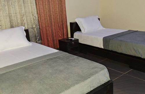 Lome Casa | Room in Guest Room - Deluxe Twin Beds in Royal Blue Guest House and Bar