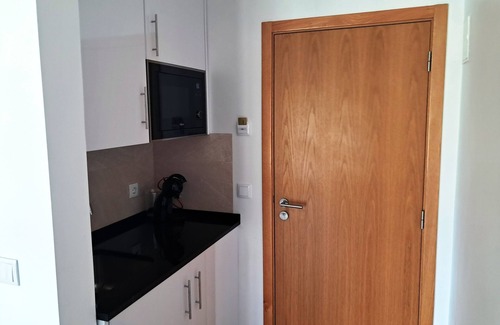 Castelo Apartamento | Room with private bathroom and pool view at Casa das Vinhas in Sesimbra