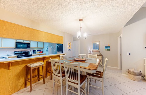 New Smyrna Beach Villa | Row-end condo with pool, clubhouse, tennis, & walk to beach
