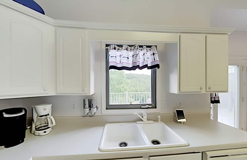 Stonecrest Casa | Rumbling Bald Resort getaway with 2 living areas, foosball & golf course views