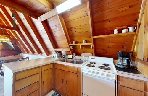 Williamsburg Casa | Rustic A-Frame Retreat on Grand Traverse Bay w/ beach, wifi, fire pit & grill