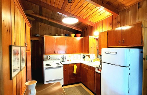 Bigfork Cabina | Rustic cabin in remote wooded area on point overlooking lake.