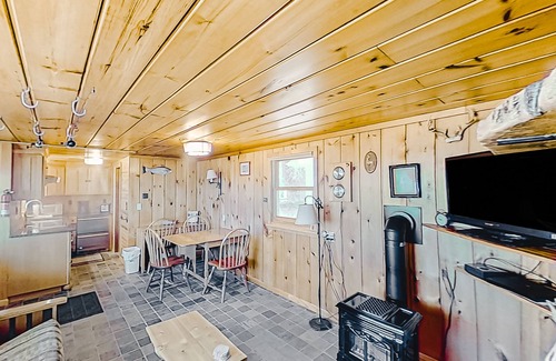 Lake Township Casa | Rustic getaway on Crystal Lake w/ firepit, guest house & private dock