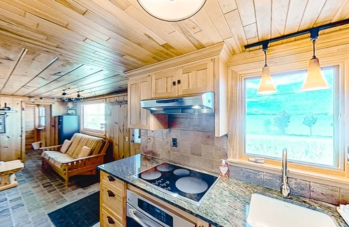 Lake Township Casa | Rustic getaway on Crystal Lake w/ firepit, guest house & private dock