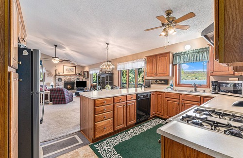 Bellaire Casa | Rustic lakefront home with large balcony, wood fireplace, grill, & washer/dryer