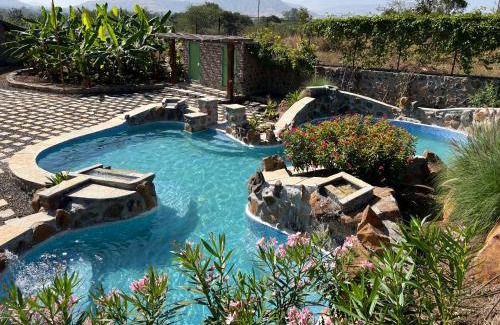Mahiravani Villa | SaffronStays Lake House Bouganvillea, Nashik - rustic pool villa with great lake views and patio dining