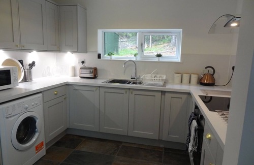 Grantown-on-Spey Cabaña | Sawmill Cottage, set in Woodland Beside the River Spey