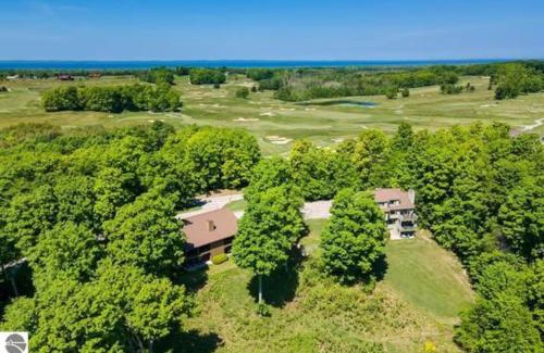 Kewadin Casa | Scenic AGaMing Escape Torch Lake Views and Golf