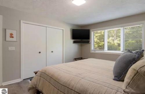 Kewadin Casa | Scenic AGaMing Escape Torch Lake Views and Golf
