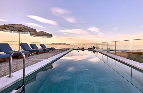 Kokkini Chani Villa | Seafront Villa with swimming pool & jacuzzi & heated pool