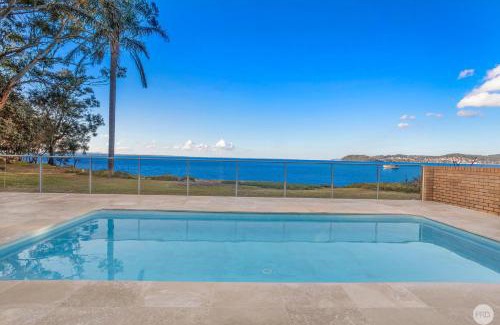 Salamander Bay Casa | Seaside Sanctuary - Waterfront Luxury Home with Heated Pool