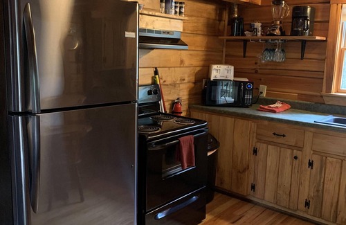 Rogers Cabina | Secluded Cabin with a private waterfall at Spirit Lake and internet