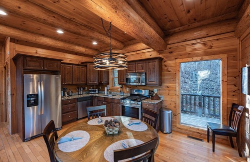 Almond Cabina | Secluded log cabin with fireplace and hot tub on deck.