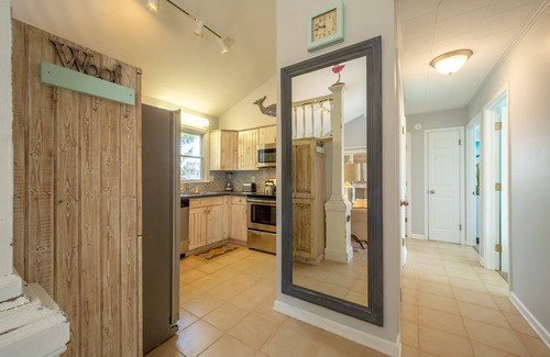 Ocean Isle Estates Casa | Semi-oceanfront dog-friendly home with private hot tub, decks & shared pool