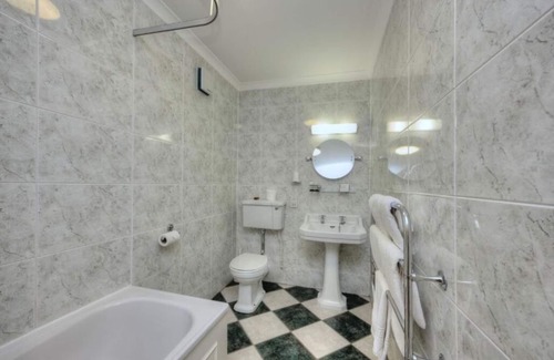 Nairn Hotel | Serene Getaway Steps from the Beach & Historic Landmarks