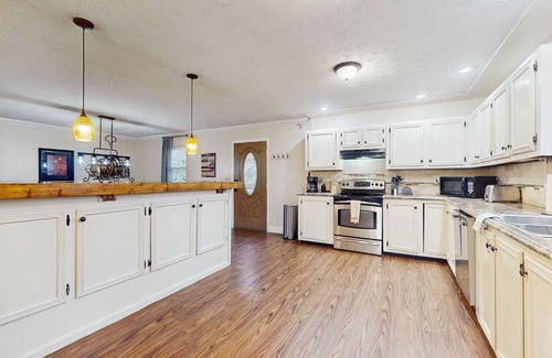 Caryville Cabina | Serene lake home with foosball, dartboard, luxe kitchen - dog friendly!
