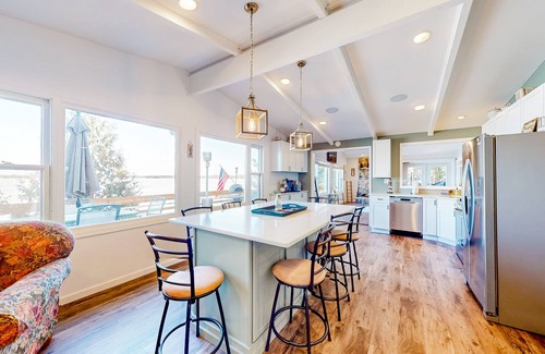 Three Lakes Casa | Serene lakefront retreat with wet bar, wraparound decks, dock, fireplaces, AC