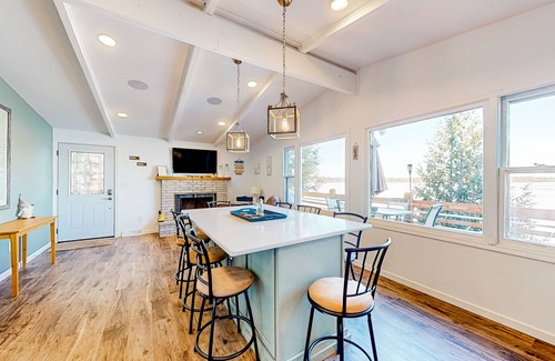Three Lakes Casa | Serene lakefront retreat with wet bar, wraparound decks, dock, fireplaces, AC