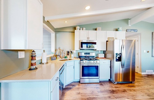Three Lakes Casa | Serene lakefront retreat with wet bar, wraparound decks, dock, fireplaces, AC