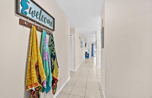 Indialantic Casa | Serene Seaside Retreat - Dog friendly - 2BR Townhouse with Shared Heated Pool Steps to Paradise Beach!