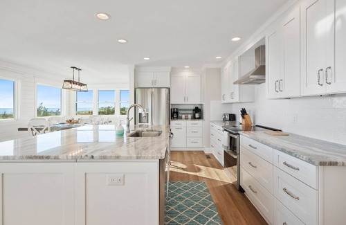 Caswell Beach Casa | Serenity by the Sea: Nostalgic Oceanfront Home with Room for the Whole Family
