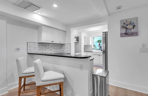 Sunset Beach Casa | Impresionante Townhome frente a la playa con piscina, barbacoa y muchas comodidades excelentes.