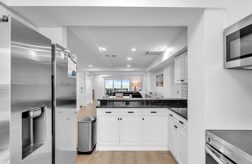 Sunset Beach Casa | Impresionante Townhome frente a la playa con piscina, barbacoa y muchas comodidades excelentes.