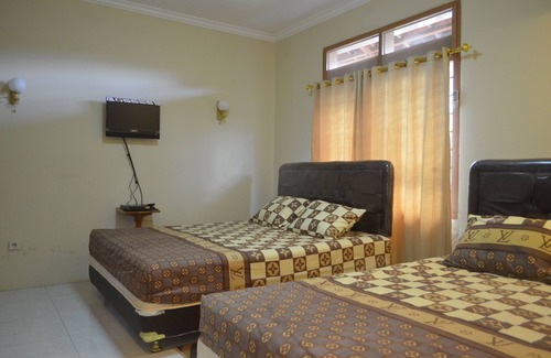 Banguntapan Casa | Sencilla 3BR Casa en Yogyakarta + WiFi + TV + Agua Caliente