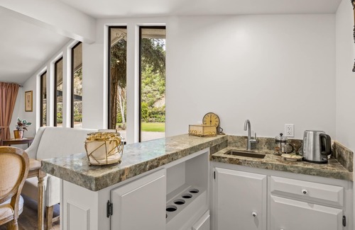 Fillmore Casa | Single-level home surrounded by lush gardens with a washer/dryer, AC, & wet bar